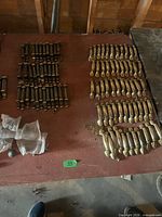 Overview showing brass and dark bronze pulls on table