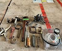All tools laid out on plywood surface
