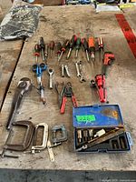 Overview of all hand tools laid out on workbench