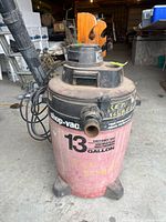 Full view of Shop-Vac 13-gallon wet/dry vacuum showing body, hose and handle