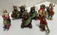 All eight wooden Christmas figurines grouped