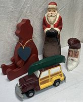 Group shot showing all four wooden holiday items