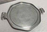 Top view of octagonal aluminum Guardian Service tray with handles