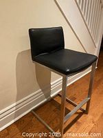 Single black leather chrome bar stool front angle