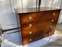 Front and side view of dresser showing drawers and top surface