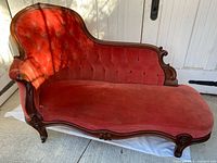 Full view of red velvet chaise lounge