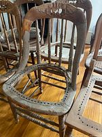Multiple oak and pine dining chair frames missing cane seats