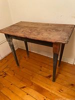Full view of wooden pantry table against wall