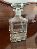 full view of square glass decanter with stopper