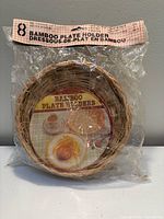 Front view of sealed package showing woven bamboo plate holder and product label