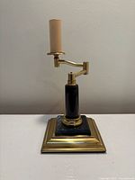 Front view showing brass socket, swing arm, marble column and brass/marble base