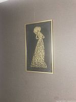 Artwork hanging on wall showing overall appearance and scale