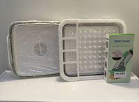 Front view of sink, dish rack and boxed brush, factory wrapped