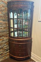 Full view of corner curio cabinet closed