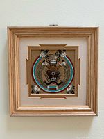 Front view of framed Navajo sandpainting