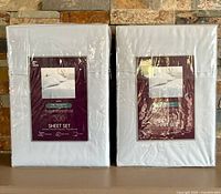 Front view of two sealed sheet sets showing brand, size, color