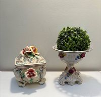 trinket box and pedestal urn side by side