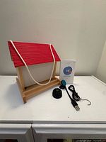 Feeder front with camera, cable, accessories and booklet visible