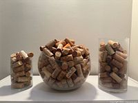 All three vases side by side showing relative sizes and cork contents