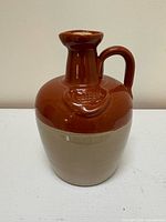 Front view of two-tone stoneware whisky jug