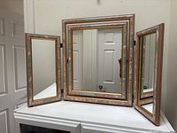 Full view of tri-fold vanity mirror with side panels open
