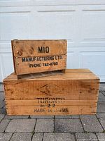 Both crates stacked for size comparison