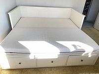 Daybed fully expanded to king size showing storage drawers