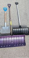 All three shovels laid out showing blades and handles