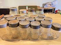 group of jars standing upright showing lids and bodies