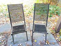 Front view of both wooden slatted folding chairs