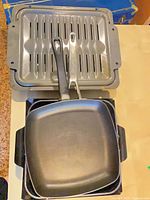 Square fry pan atop broiler pan
