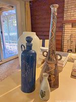 All four vases grouped together showing size and color variety