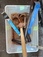 Top view of bin with assorted tools