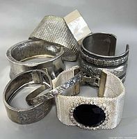 Group of seven silver-tone cuff bangles