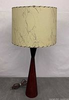 Lamp unlit, showing overall form, base, shade, cord