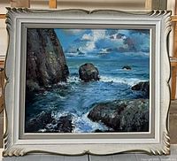 Front view of framed seascape oil painting