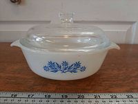 Side view of casserole showing blue cornflower pattern and lid fitted