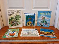 All six books laid out on table