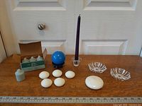 Group shot of all candles and holders on table