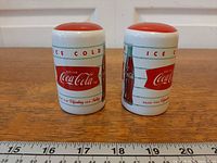 Front view of both shakers showing logo and stripes