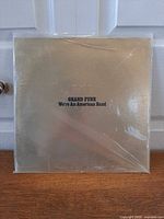 Front cover showing gold foil sleeve and title