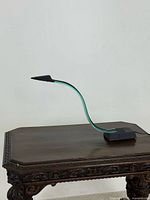 Full view of cobra lamp on table