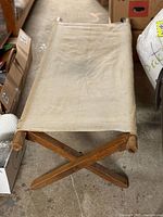 Top view of folding wood frame cot showing full canvas surface