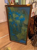 Full view of framed abstract acrylic painting, blue and green tones