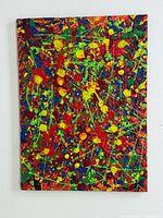 Front view of brightly coloured splatter painting showing signature and heavy impasto