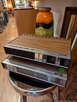 Both Philips components stacked, showing wood cabinets and front control panels
