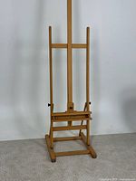 Full view of tall adjustable wooden easel front