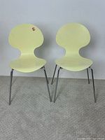 Front view of both cream Palazetti Ant chairs standing side by side