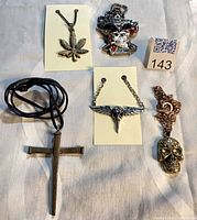 Group shot of all five necklaces displaying pendants and chains