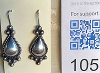 front view showing teardrop design and bead accents